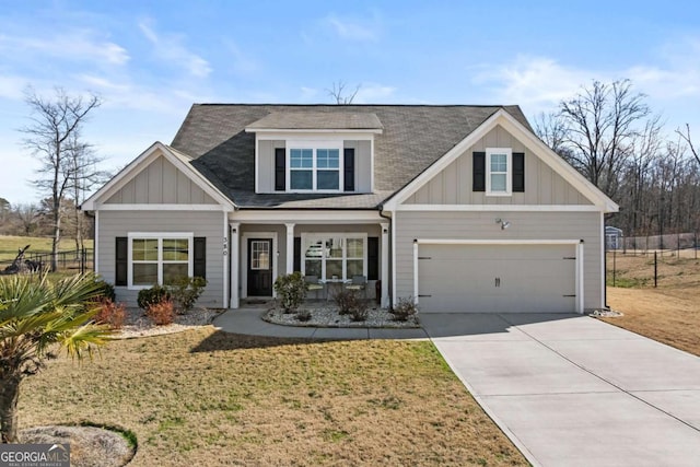 view of front of house with a garage, a front lawn, board and batten siding, and concrete driveway