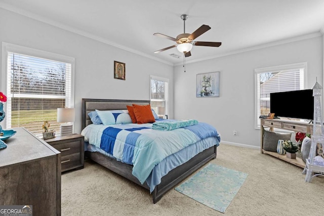 bedroom featuring multiple windows, ornamental molding, and light colored carpet