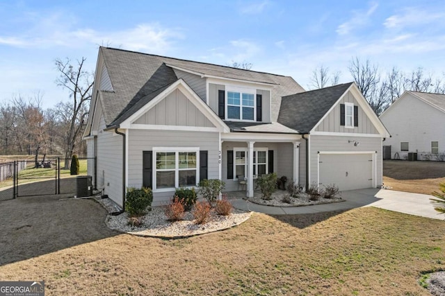 view of front of house with a garage, a gate, board and batten siding, and concrete driveway