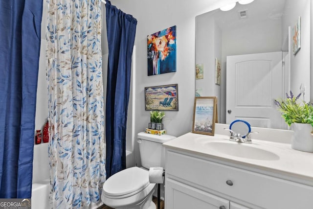 bathroom with toilet, shower / tub combo, visible vents, and vanity