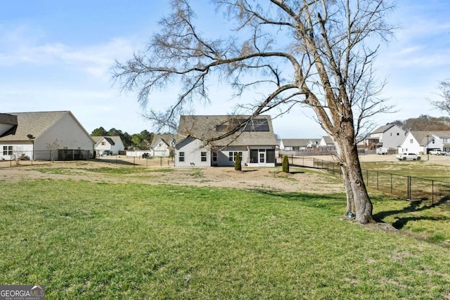 view of yard featuring a residential view and fence