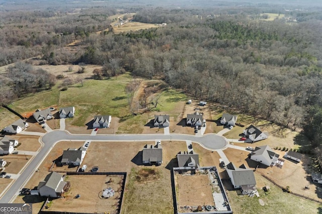 aerial view featuring a view of trees