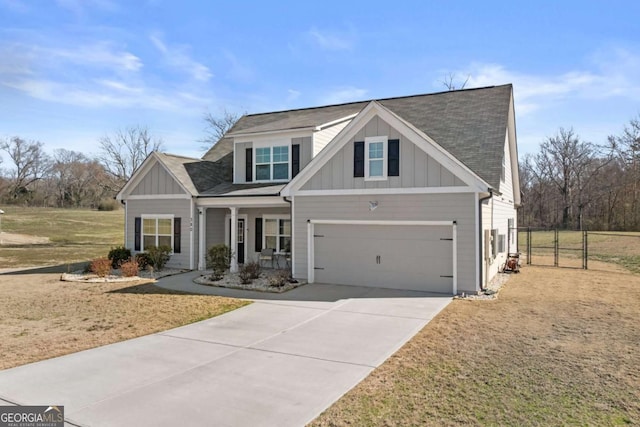 view of front of property with driveway, a garage, a shingled roof, a porch, and board and batten siding