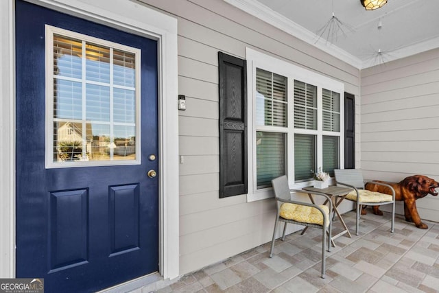 doorway to property with covered porch