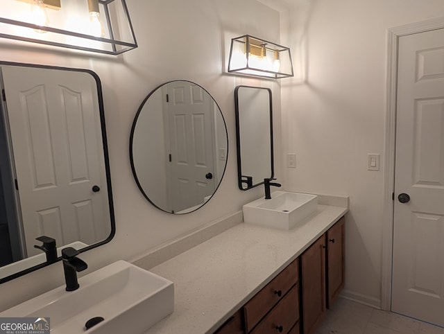 bathroom with double vanity and a sink