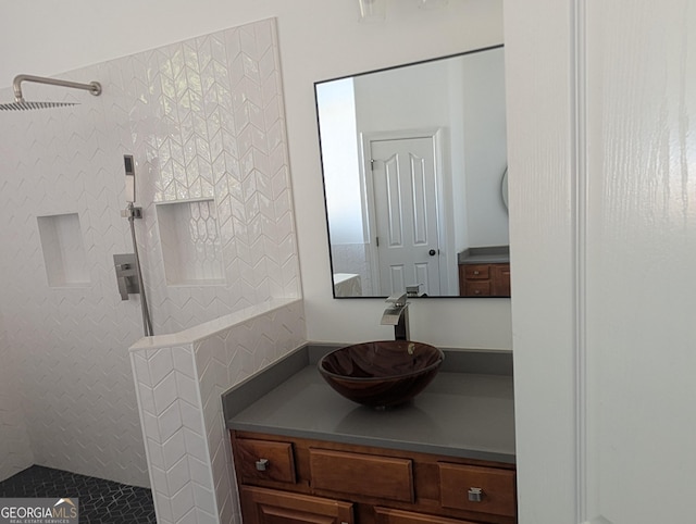 full bathroom with walk in shower and vanity