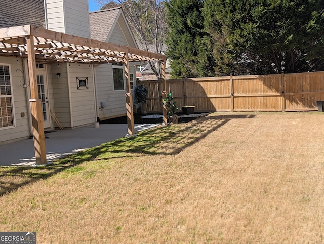 view of yard with a patio area, fence, and a pergola