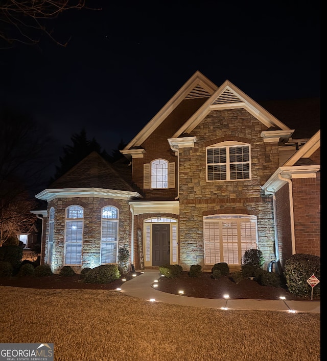 view of front of home with stone siding