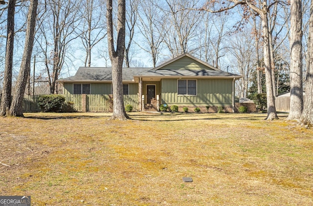 ranch-style home with a front lawn