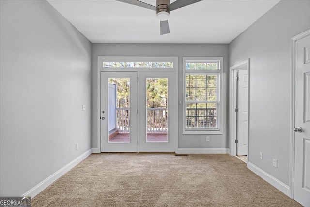 doorway to outside with carpet, ceiling fan, and baseboards