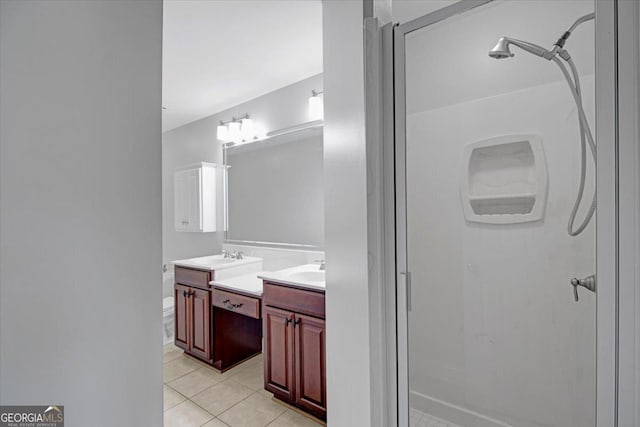 full bath featuring tile patterned floors, a shower stall, and vanity