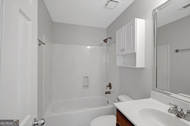 bathroom featuring toilet, bathtub / shower combination, visible vents, and vanity