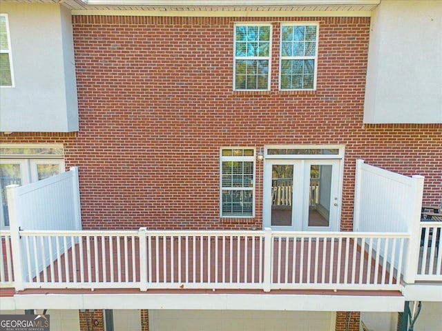 view of side of home with brick siding