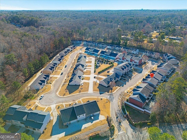 aerial view featuring a view of trees