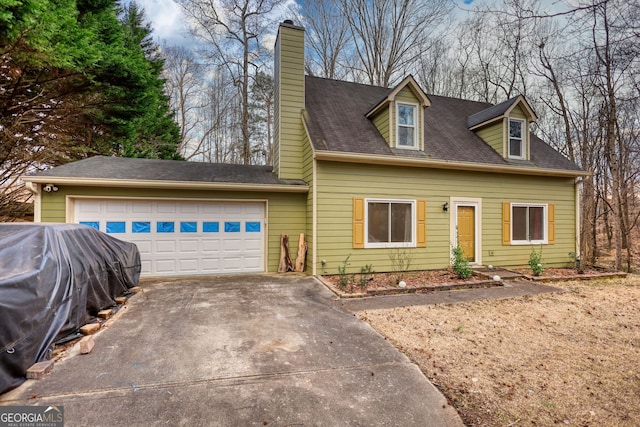 cape cod home with an attached garage, driveway, and a chimney