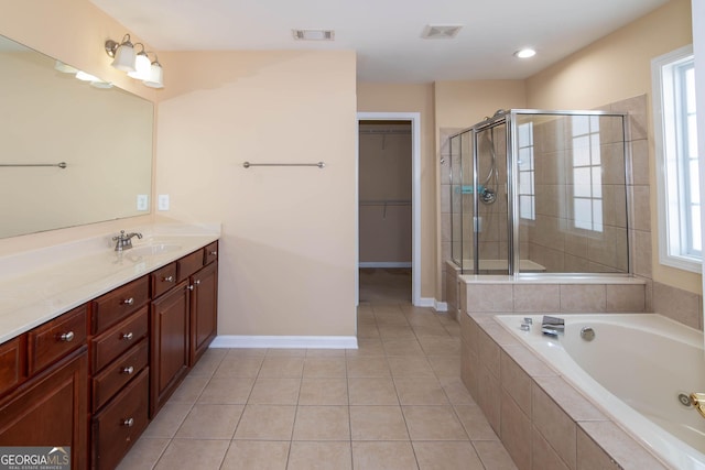 bathroom featuring a shower stall, visible vents, tile patterned flooring, and vanity