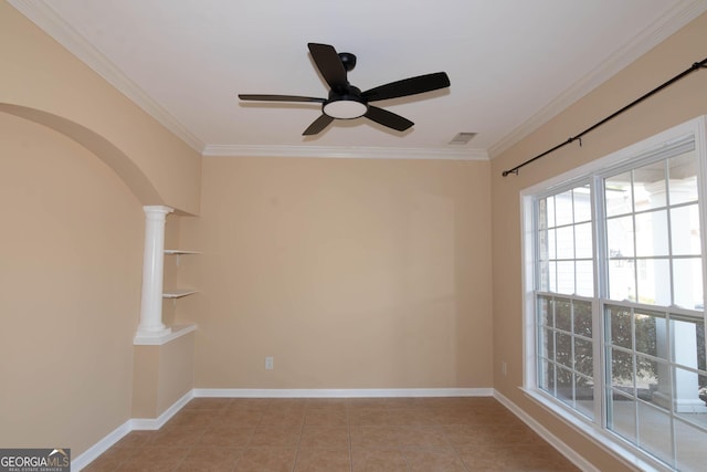 spare room with arched walkways, light tile patterned flooring, baseboards, ornamental molding, and decorative columns