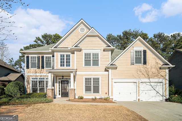 craftsman-style house with driveway and an attached garage