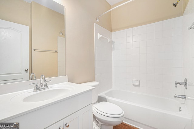 full bath with shower / washtub combination, vanity, toilet, and wood finished floors