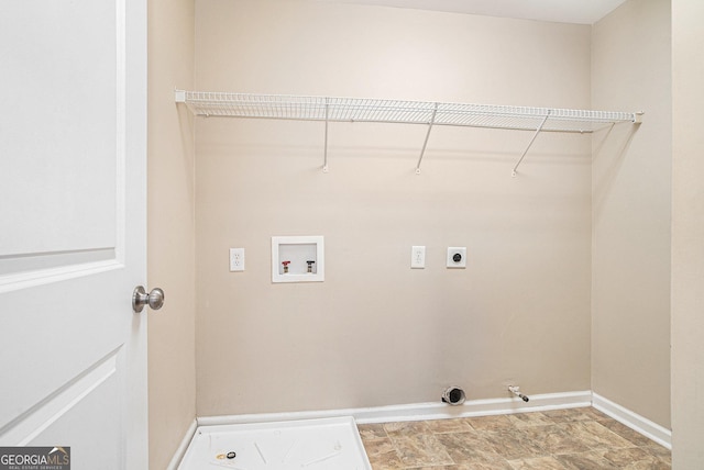 laundry room featuring hookup for a washing machine, hookup for an electric dryer, gas dryer hookup, laundry area, and baseboards