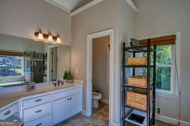 bathroom with toilet, visible vents, baseboards, vanity, and crown molding