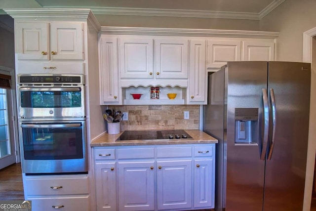 kitchen featuring white cabinets, ornamental molding, stainless steel appliances, open shelves, and backsplash