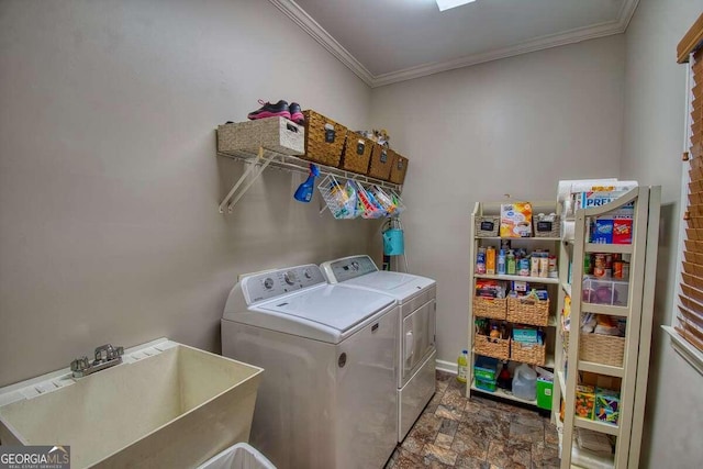 laundry room with ornamental molding, stone finish flooring, a sink, separate washer and dryer, and laundry area