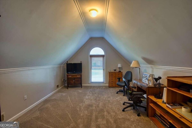 unfurnished office featuring lofted ceiling, carpet flooring, visible vents, and baseboards