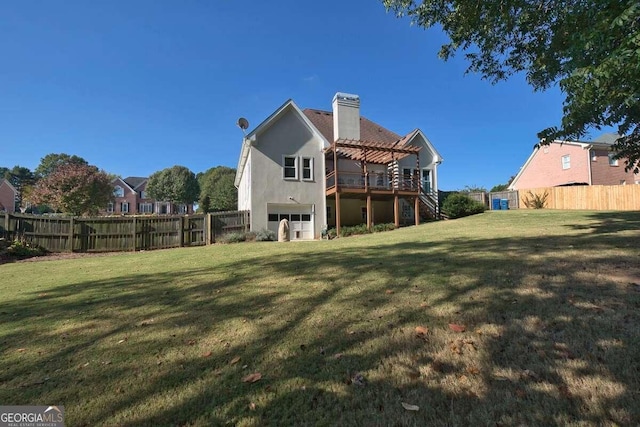 back of property featuring a fenced backyard, a chimney, stairway, and a yard