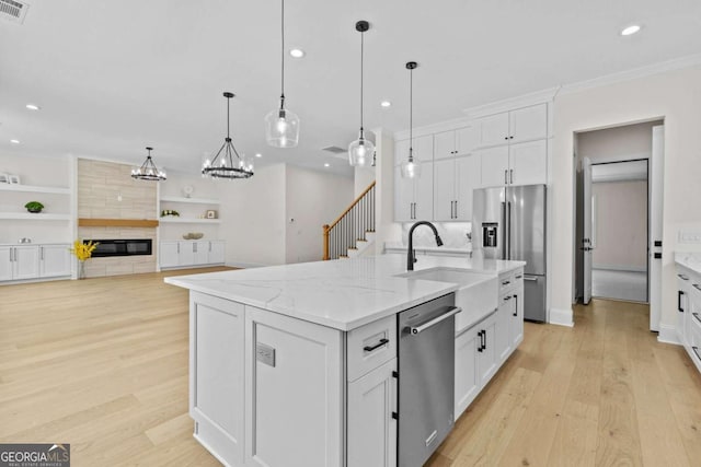 3636 Castoff Ct, Gainesville, GA 30506 - kitchen with light wood-style flooring, white cabinetry, and stainless steel appliances