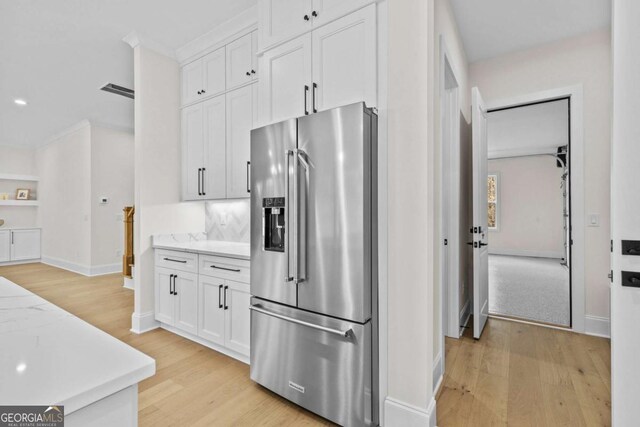 3636 Castoff Ct, Gainesville, GA 30506 - kitchen featuring high end fridge, light wood-type flooring, white cabinetry, and baseboards