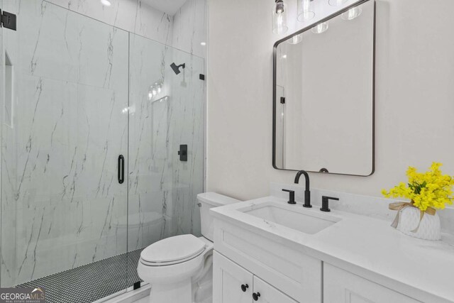 3636 Castoff Ct, Gainesville, GA 30506 - bathroom featuring a marble finish shower, vanity, and toilet