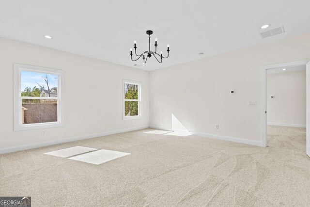 3636 Castoff Ct, Gainesville, GA 30506 - carpeted spare room featuring recessed lighting, visible vents, a notable chandelier, and baseboards