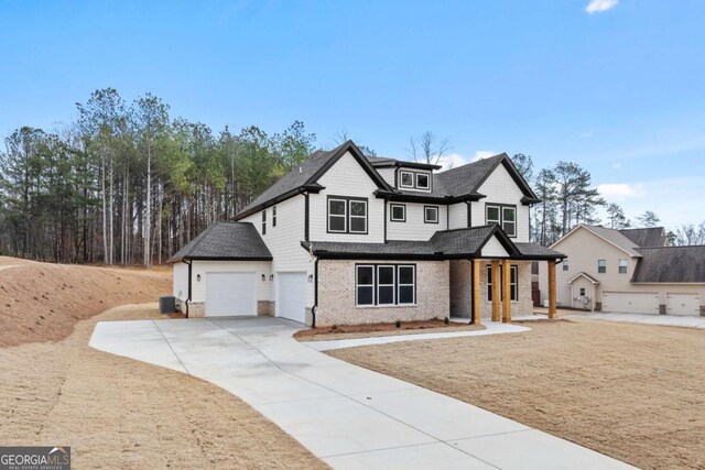 3636 Castoff Ct, Gainesville, GA 30506 - modern farmhouse style home with cooling unit, brick siding, and driveway