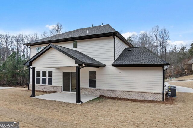 3636 Castoff Ct, Gainesville, GA 30506 - back of house featuring a patio, roof with shingles, cooling unit, a yard, and brick siding
