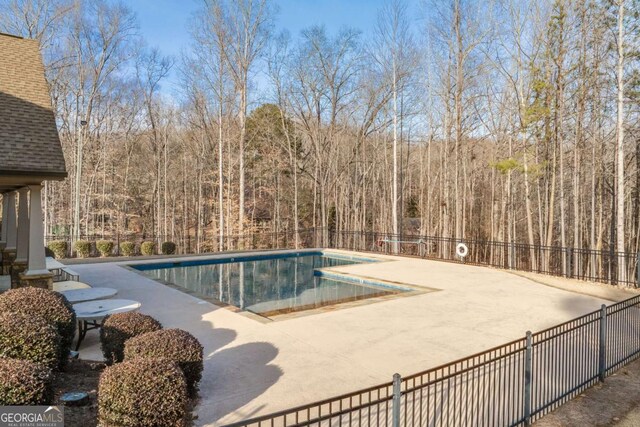 3636 Castoff Ct, Gainesville, GA 30506 - pool featuring a patio, a forest view, and fence