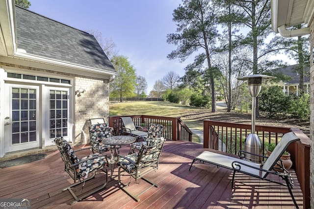 deck featuring a yard