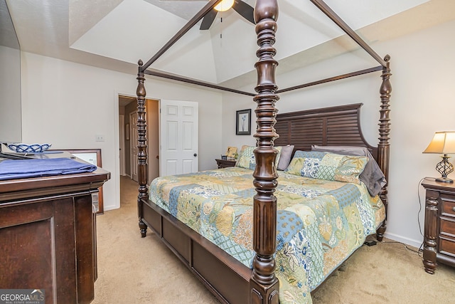 bedroom featuring light carpet, vaulted ceiling, a ceiling fan, and baseboards