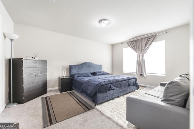 carpeted bedroom with baseboards