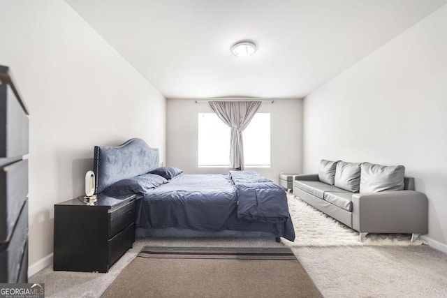 carpeted bedroom with baseboards