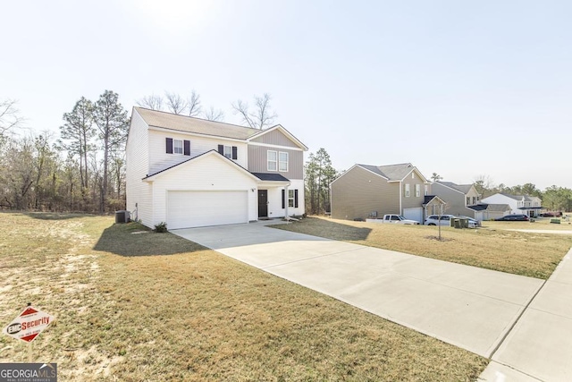 traditional-style home with a garage, cooling unit, driveway, and a front yard