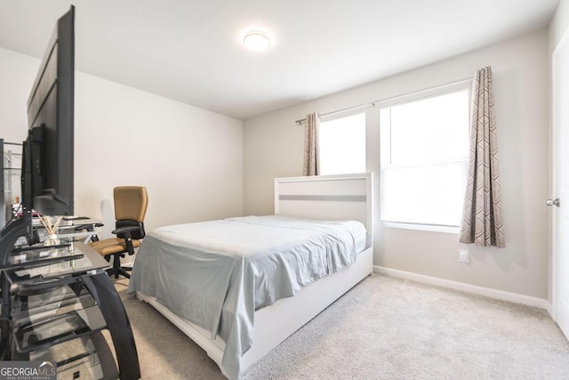 bedroom with carpet and baseboards