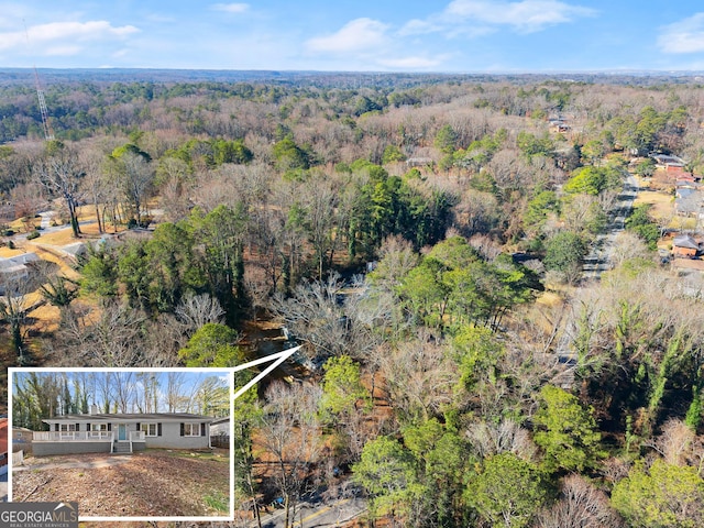 drone / aerial view with a view of trees