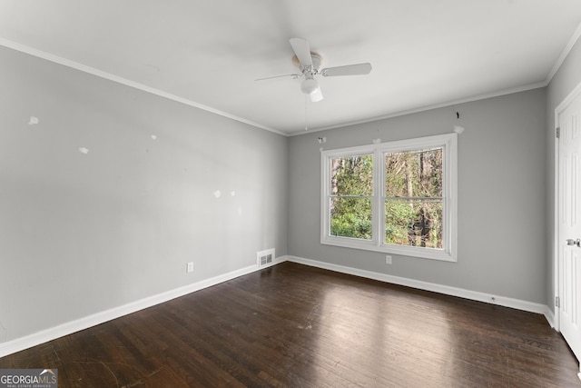 unfurnished room with wood finished floors, a ceiling fan, visible vents, baseboards, and ornamental molding