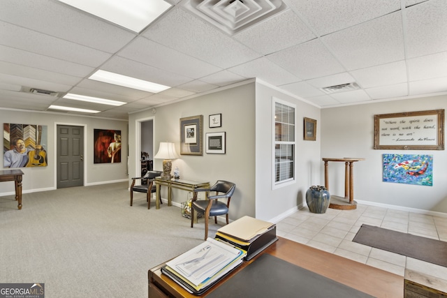 interior space with a paneled ceiling and visible vents