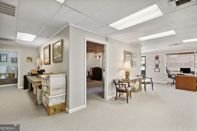 office area with carpet, visible vents, a paneled ceiling, and baseboards