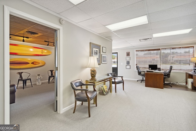 home office with visible vents, a drop ceiling, and carpet flooring