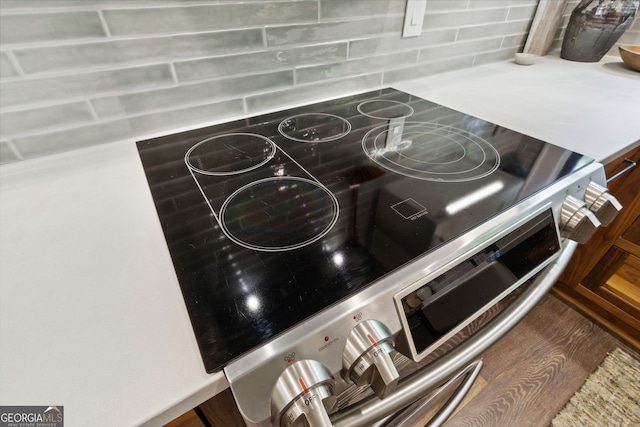 interior details featuring stainless steel range with electric cooktop