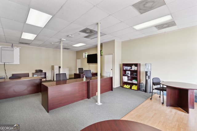 office area featuring carpet and a paneled ceiling