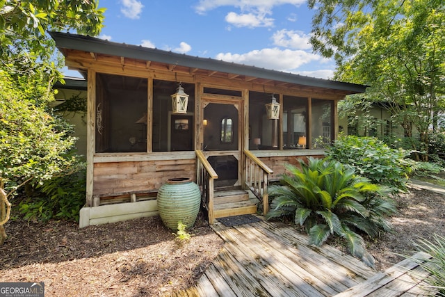 exterior space with a sunroom